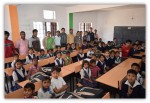 IIM Indore distributes shoes, socks, sweaters and bags amongst school students